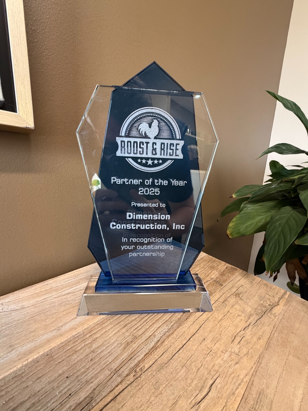 Roost & Rise Partner of the Year 2025 award presented to Dimension Construction, Inc.